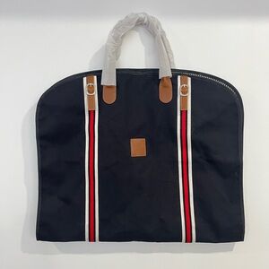 Stylish Black Travel Bag with Brown Accents